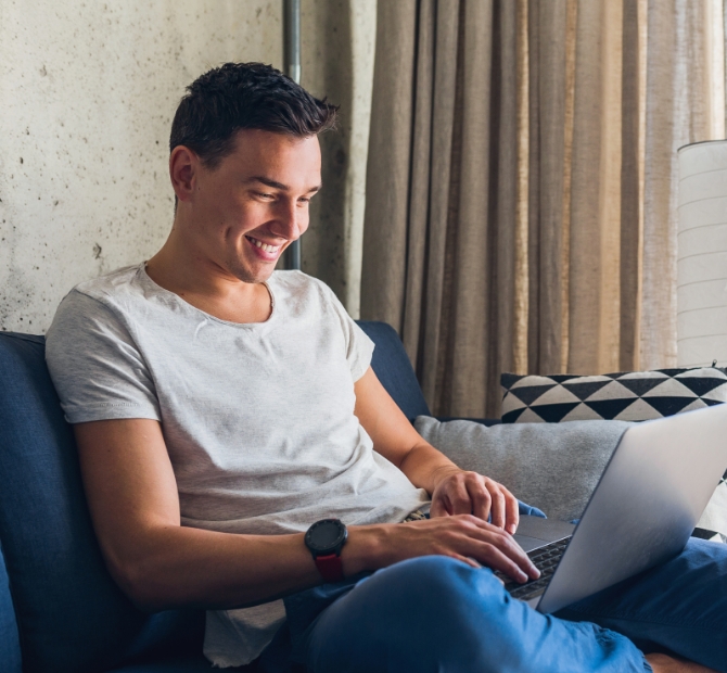 Young attractive man using laptop