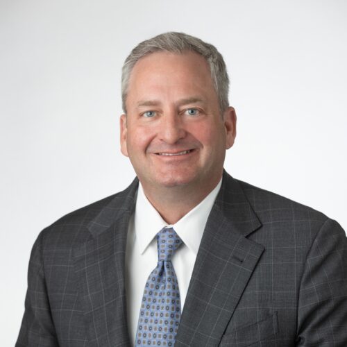 Clay Jones headshot in suit and tie