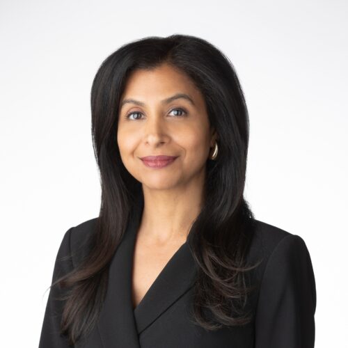 Headshot of Janisha Sabnani in a black suit